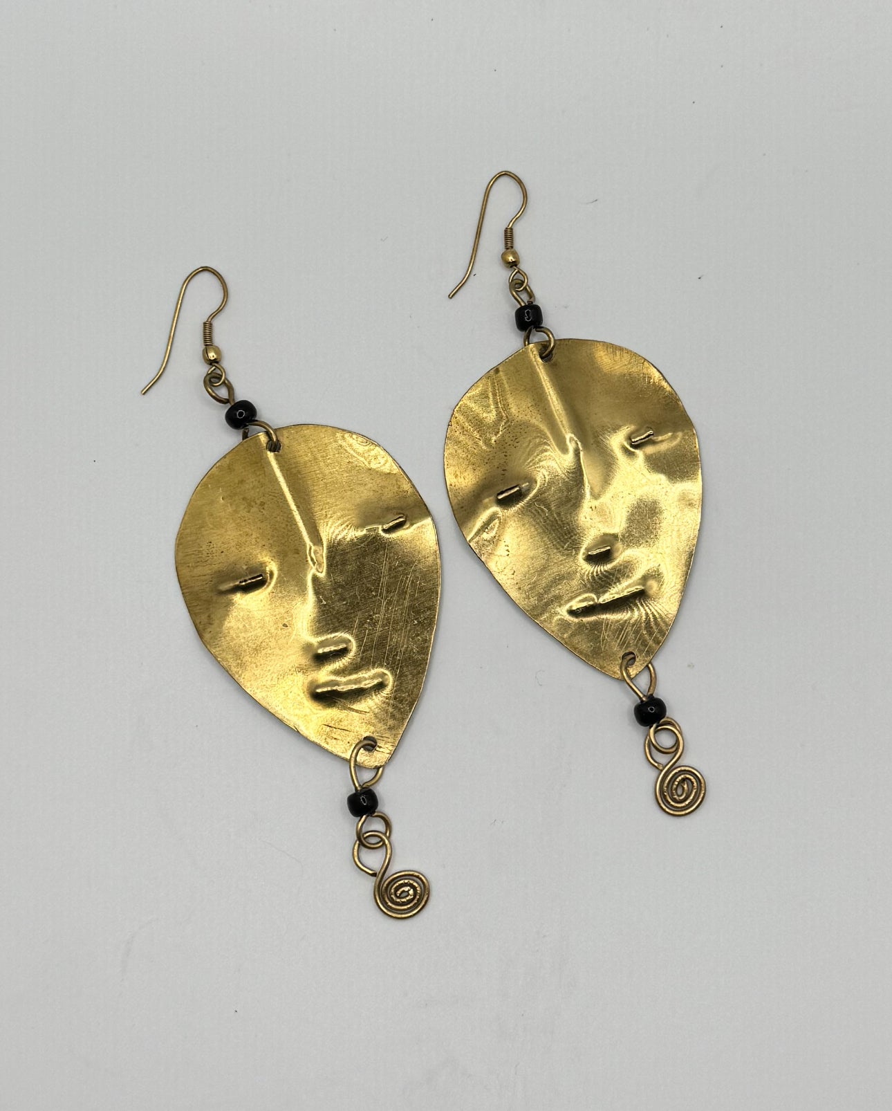 The Brass Mask Swirl Earrings